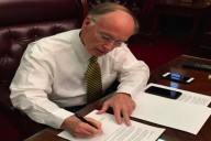 Alabama Governor Robert Bentley signs Executive Order 14 instructing state agencies to use "all lawful means necessary" to keep Syrian refugees from resettling in the state. (Photo: Governor's Office)