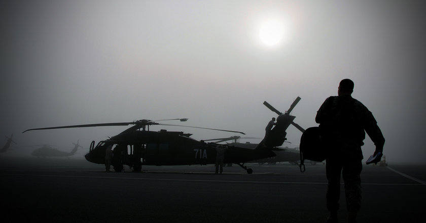An instructor approaches a Black Hawk helicopter on Fort Rucker (Photo: Fort Rucker Flickr photostream)
