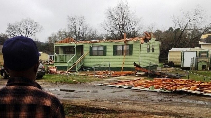 Charlie Baldwin, 72, looks toward his destroyed home in the Hillman Station area of Birmingham after an EF-2 tornado tore through the neighborhood. (Michael Sznajderman/Alabama NewsCenter)