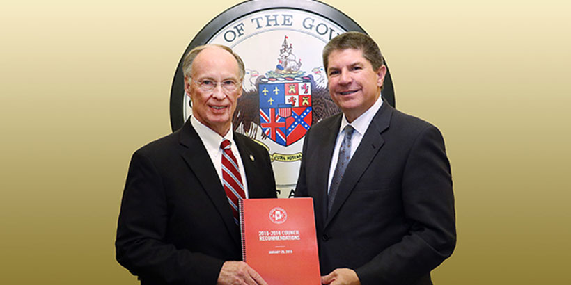 Alabama Gov. Robert Bentley receives an official report prepared by the Alabama Workforce Council (AWC) from Zeke Smith, AWC Chairman and Alabama Power executive, at the state Capitol in Montgomery on Tuesday, Feb. 2, 2016. The report details recommendations from the AWC to transform workforce development efforts and improve educational outcomes in the state. (Governor's Office, Jamie Martin)