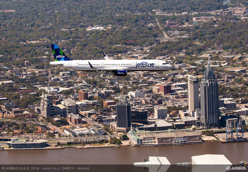 The first Alabama-made A321, sporting JetBlue livery, cruises over Mobile on its initial test flight. (Image: Airwind via Airbus)