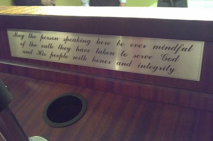 Engraving on the back of the Governor of Alabama's podium in the press briefing room of the State Capitol. 