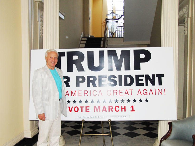 Alabama’s Donald Trump campaign chair Perry Hooper Jr. stands by a large Trump sign inside Knox Hall.