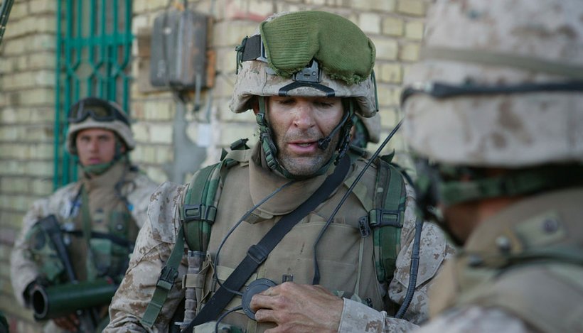 Then-Capt. Doug Zembiec, the commanding officer of Company E, 2nd Battalion, 1st Marine Regiment, 1st Marine Division, gives orders to his men over a radio prior to leaving their secured compound for a short patrol in Fallujah, Iraq April 8, 2004.  (Photo: Sgt. Jose E. Guillen - U.S. Marines)