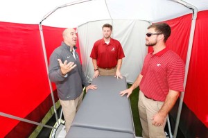 From left, Jeff Allen, director of sports medicine at UA, Jared Cassity and Patrick Powell have formed a company, Kinematic Sports, that licensed the intellectual property of the SidelinER.