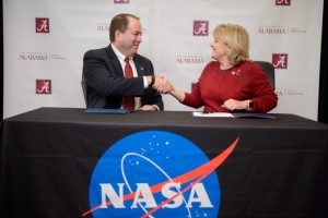 Carl A. Pinkert, vice president for research and economic development at the University of Alabama, and Joan A. “Jody” Singer, deputy director of NASA’s Marshall Space Flight Center, sign a Space Act Agreement.