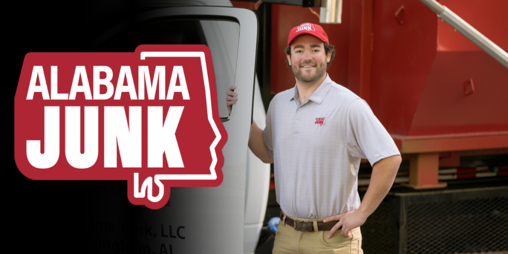 A smiling Chase Neblett wearing an ‘Alabama Junk’ hat and polo shirt stands confidently beside a truck and red dumpster. The ‘Alabama Junk’ company logo, shaped like the state of Alabama with bold white and red lettering, is displayed on the left side of the image.”